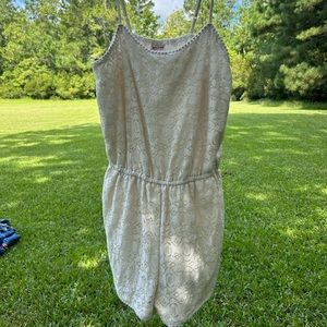 Good condition, very comfortable romper with adjustable straps.